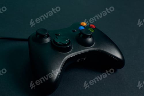 Preview: Close-up video game console controller on a black background