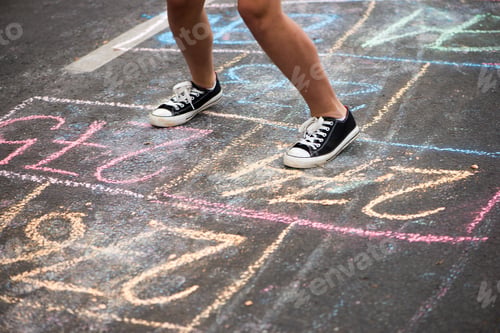 Preview: girl playing hopscotch on playground outdoor