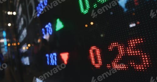 Preview: Stock market graph showing prices on window screen at night