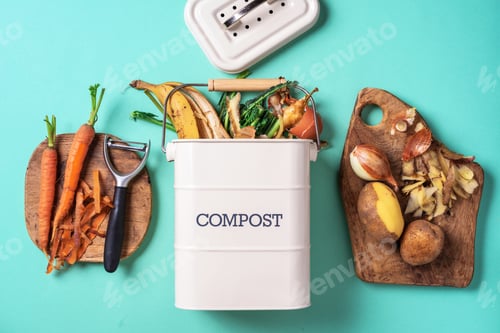 Preview: Top view of kitchen food waste collected in recycling compost pot. Peeled vegetables on chopping