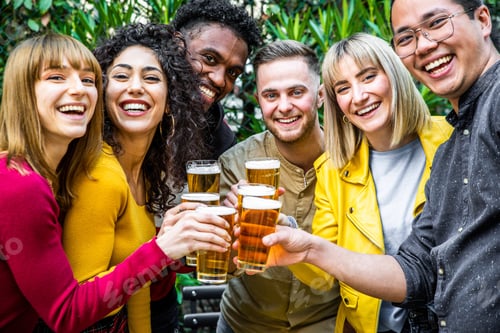 Preview: Multicultural group friends drinking and toasting beer glasses at brewery bar restaurant