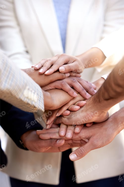 Preview: Lets all show our support. Shot of a group of unrecognizable businesspeople stacking their hands.