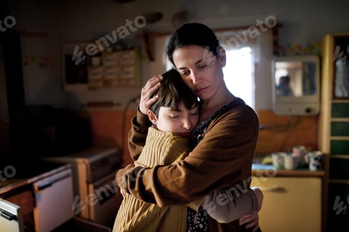 Preview: Portrait of sad poor mature mother hugging small daughter indoors at home, poverty concept