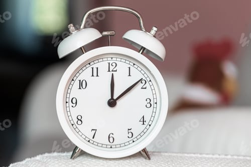 Preview: Vintage alarm clock is on the sofa. Dinner and wake up. Deadline, concept