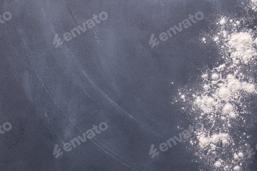 Preview: Baking or cooking background, flour on the dark background