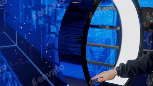 Preview: IT specialist standing In front of modern computer and activating data center with gestures. Media