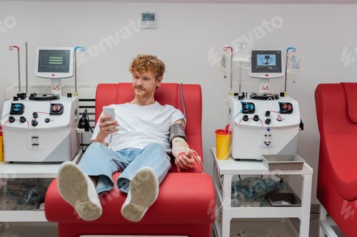 Preview: Young Man Relaxing During Blood Donation