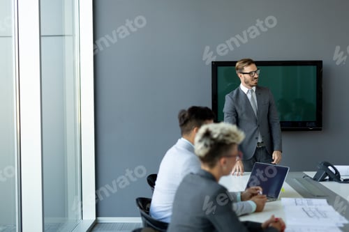 Preview: Group of business people collaborating in office