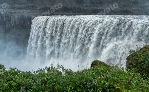 Preview: Majestic waterfall cascading over rocky cliffs