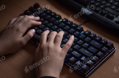 Preview: Closeup shot of hands on a mechanical keyboard
