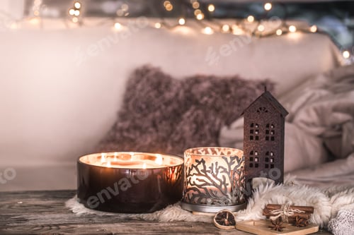 Preview: home still life in the interior with beautiful candles, on the background of a cozy home decor