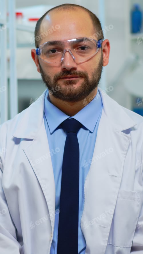 Preview: Tired doctor looking exhausted at camera