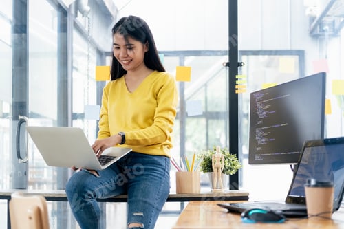 Preview: Young Woman Working And Programming On Computer In Office.