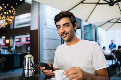 Preview: young 20s male blogger using smartphone for checking notifications on recreation time