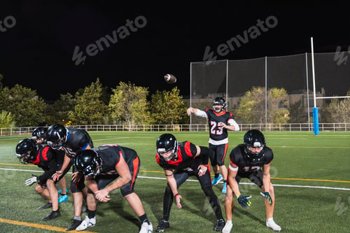 Preview: Football players training during night game on field