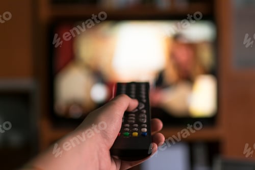 Preview: Hand using a remote to change.