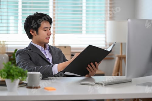 Preview: Young asian man startup business entrepreneur working at modern workplace.