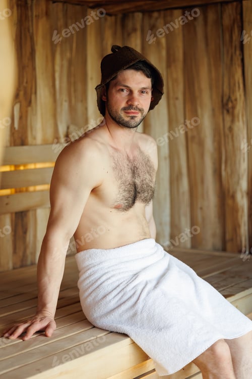 Preview: Handsome man relaxing at sauna