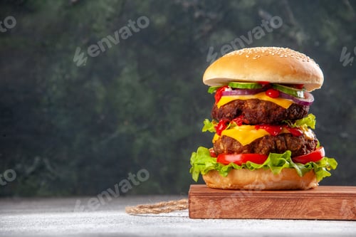 Preview: Front view of delicious homemade sandwich on wooden board on blurred background with free space