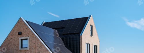 Preview: Modern Home With Solar Panels Under Clear Blue Sky