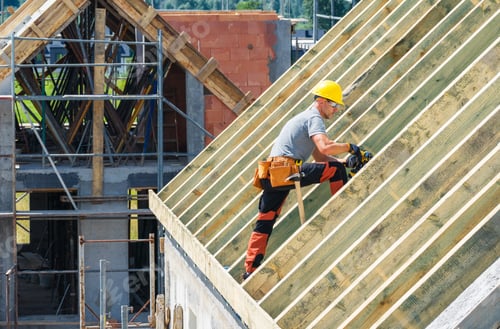 Preview: Construction Worker Installing Wooden Beams on a Roof in a Sunny Location