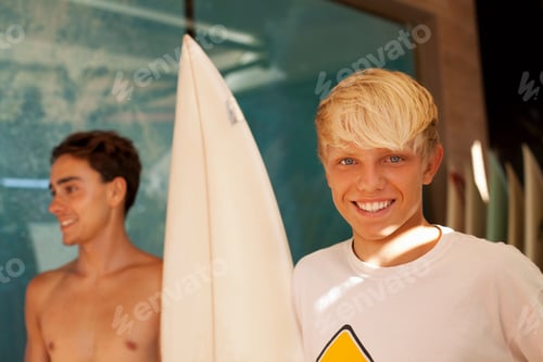 Preview: Two young men with surfboard