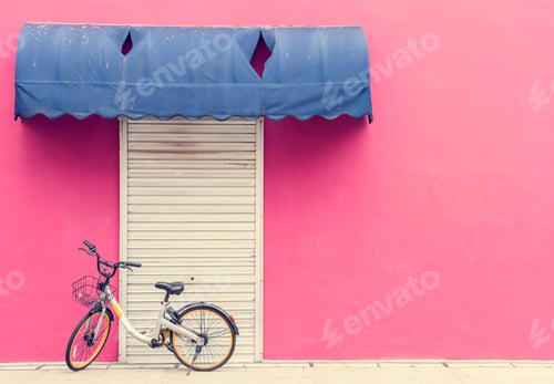 Preview: Pink wall with a bicycle