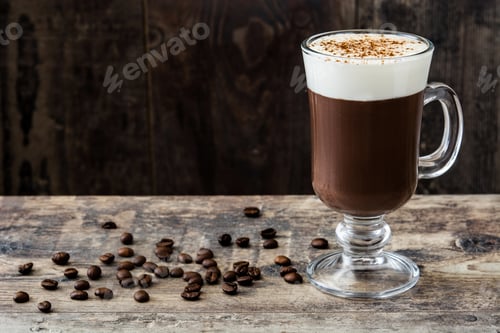 Preview: Irish coffee with whipped cream and coffee beans on rustic wooden table