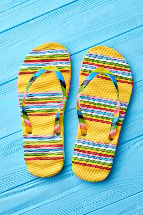 Preview: Yellow Striped Flip Flops on Light Blue Wood