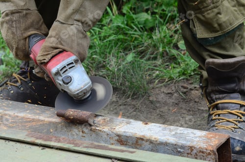 Preview: Electric wheel grinding on steel structure outdoors