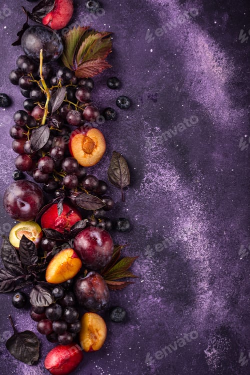 Preview: Assortment of purple fruit plum, grape, blueberry and basil