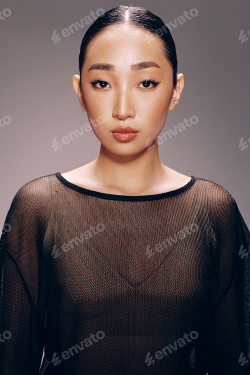 Preview: Asian woman, sheer top, posing, camera, gray background stylish asian woman wearing a sheer top