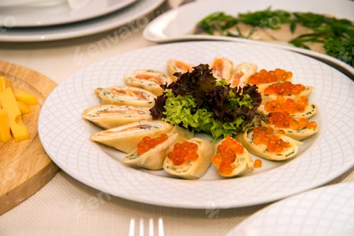 Preview: Pancakes with red fish and red caviar serving at a banquet
