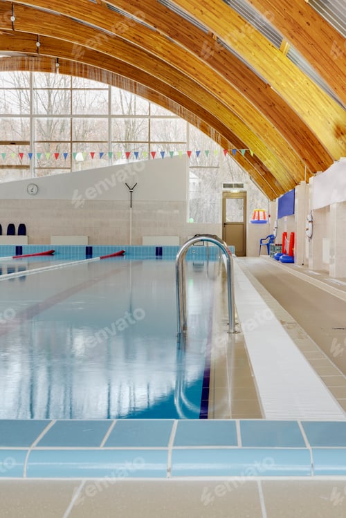 Preview: Roof beams under a curved roof over an indoor swimming pool.