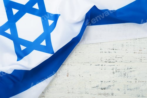 Preview: Independence Day of Israel. National Israel flag with star of David over white wooden background. Cl