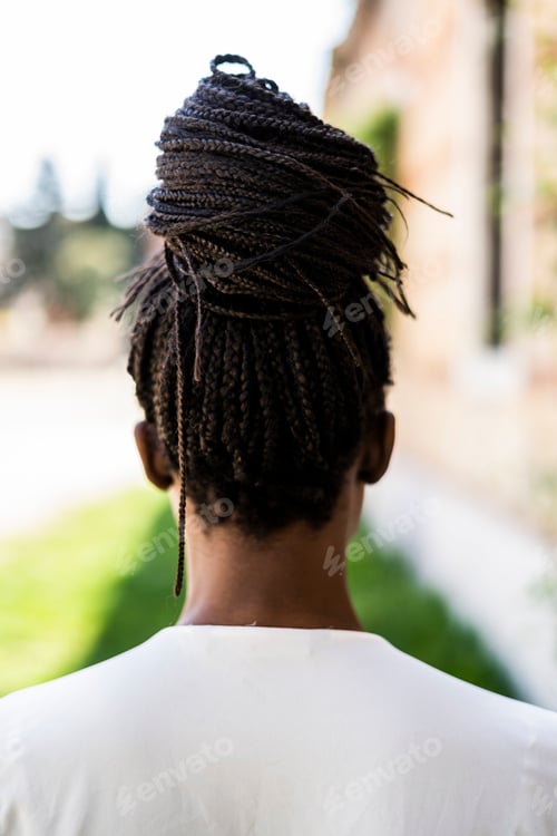 Preview: Rear view of woman with afro hairstyle