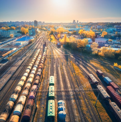 Preview: Aerial view of freight trains on railway station at sunset