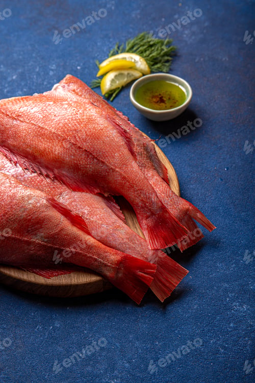 Preview: Fresh red sea bass on blue background.