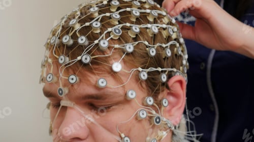 Preview: Tests at the hospital. Stock footage. A man to whom new equipment is attached to check the work of
