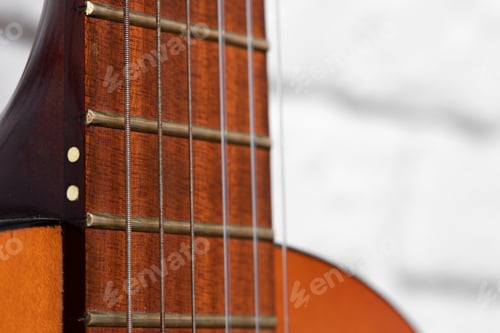 Preview: Guitar fingerboard with strings close up photo