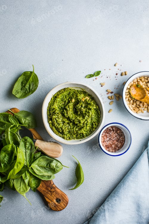 Preview: Pesto sause and ingredients on white background, copy space