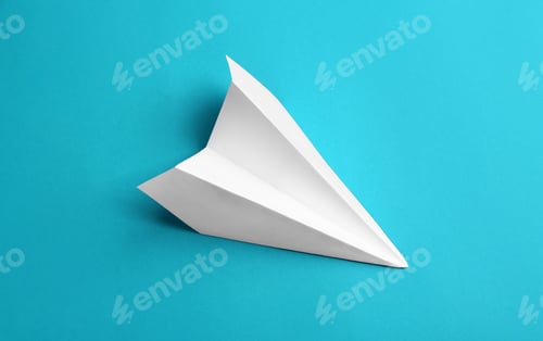 Preview: White paper plane on light blue background