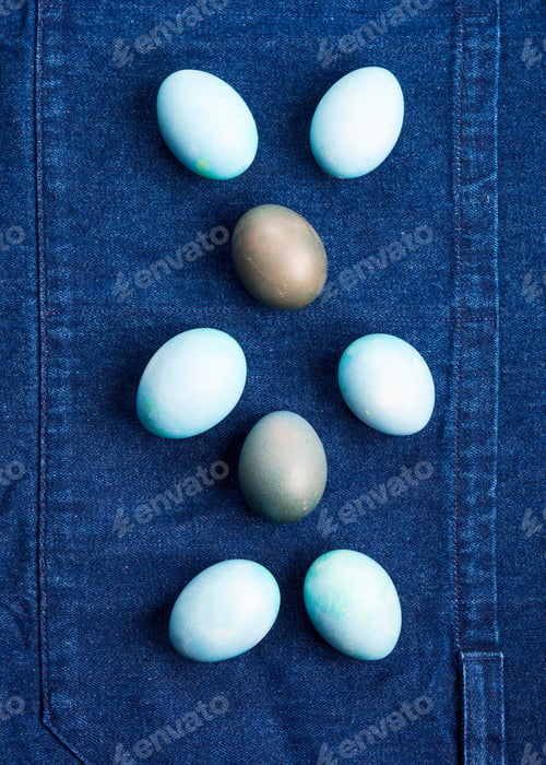 Preview: Easter boiled eggs as bunny symbol on blue