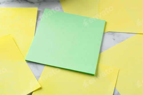 Preview: Blank notes on white marble table, closeup. Space for text