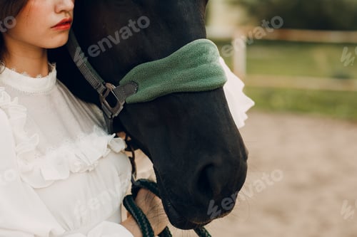 Preview: Woman with her horse at outdoors ranch