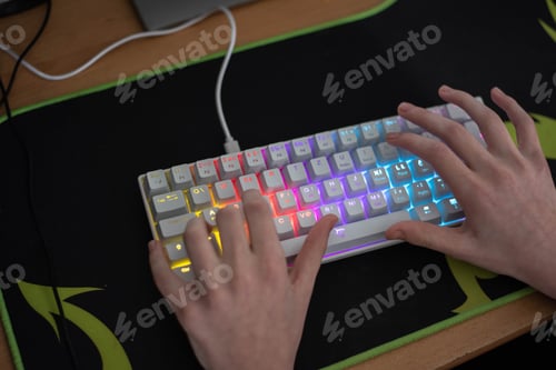 Preview: A close up shoot of a young boy using colorful keyboard