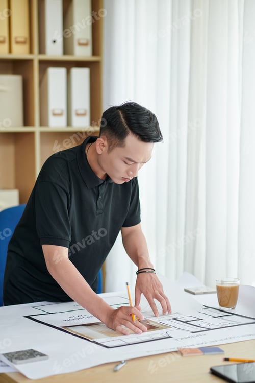 Preview: Architect Correcting House Blueprint