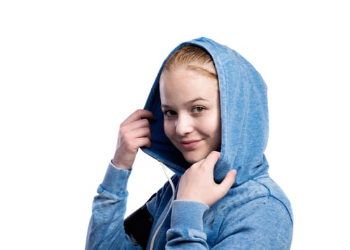 Preview: Teenage girl in blue sweatshirt. Studio shot, isolated.