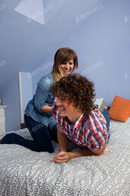Preview: Young woman tickling husband