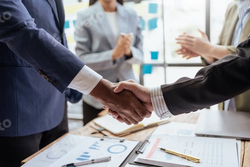 Preview: Business success. Business people handshake agreement confirmed in the investment business.